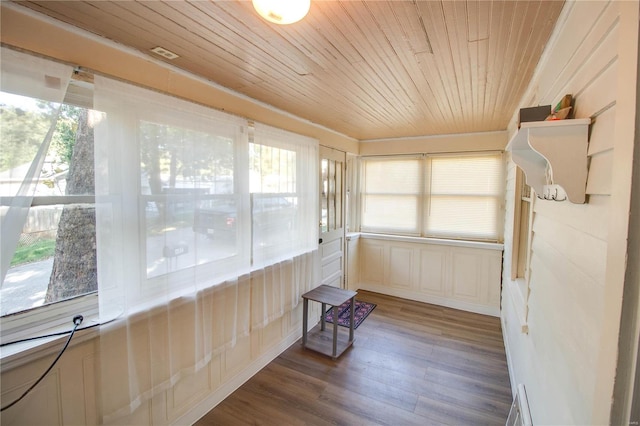 unfurnished sunroom featuring a wealth of natural light and wooden ceiling