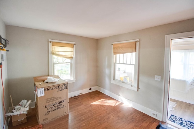 spare room with wood-type flooring