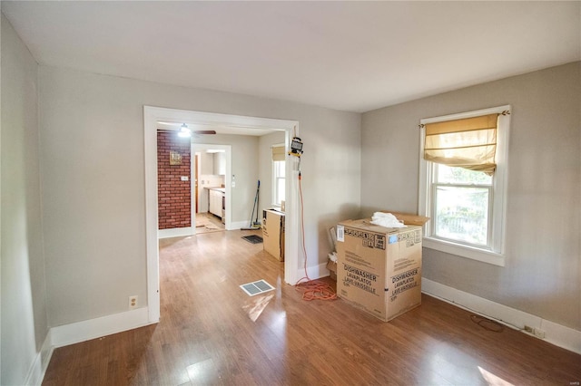 spare room featuring wood-type flooring