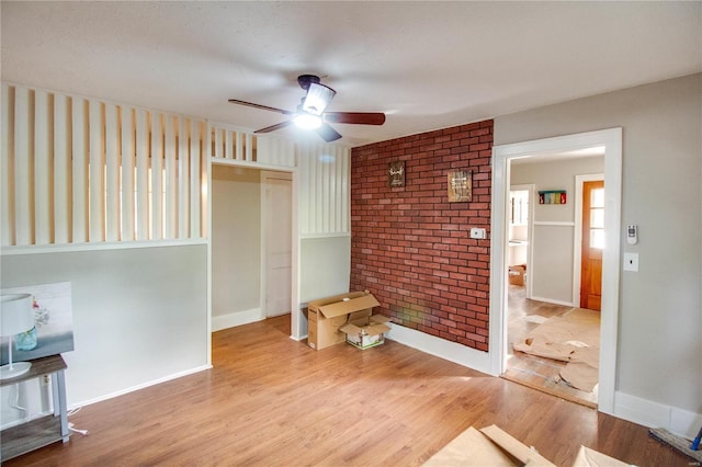 living room with light wood-type flooring and ceiling fan