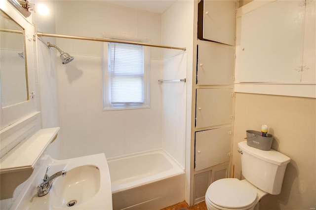 full bathroom with sink, bathtub / shower combination, and toilet