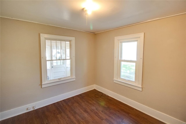 unfurnished room with a wealth of natural light and wood-type flooring