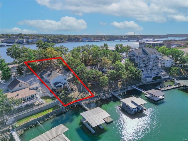 birds eye view of property with a water view