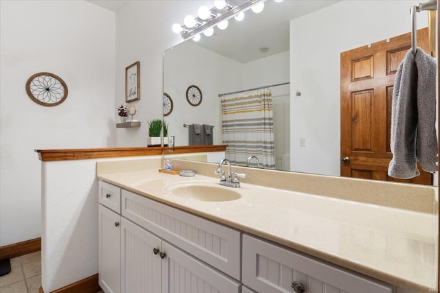 bathroom featuring vanity, tile patterned floors, and walk in shower