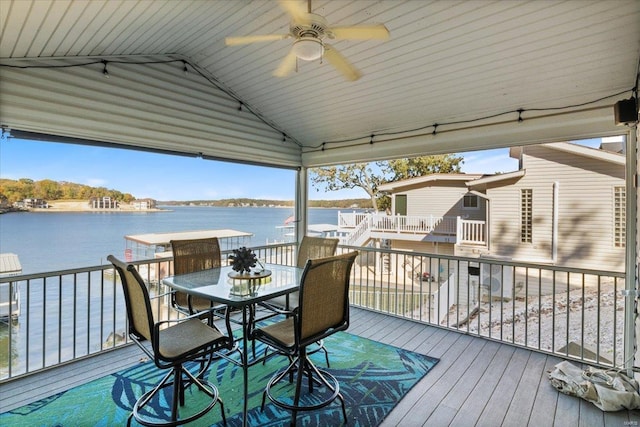 wooden terrace featuring a water view and ceiling fan