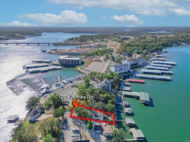 birds eye view of property featuring a water view