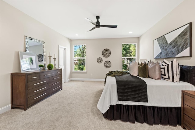 bedroom featuring ceiling fan and light colored carpet