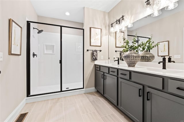 bathroom featuring vanity, tile patterned floors, and an enclosed shower