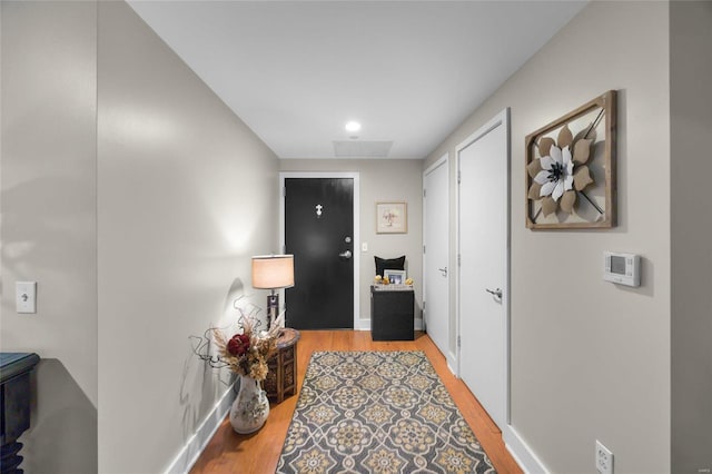 corridor featuring light hardwood / wood-style floors