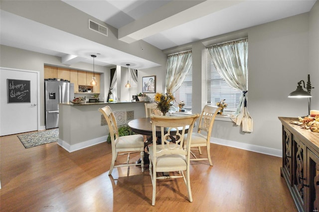 dining room with dark wood-type flooring