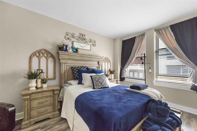 bedroom with hardwood / wood-style floors