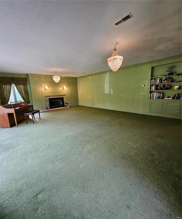 unfurnished living room featuring carpet floors, a brick fireplace, an inviting chandelier, and a textured ceiling