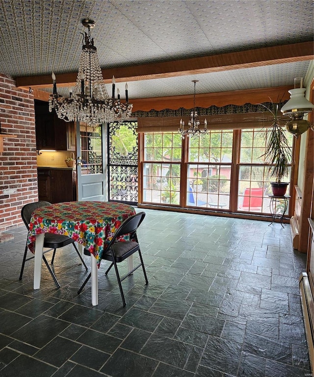 unfurnished dining area featuring a notable chandelier, beamed ceiling, and a baseboard radiator