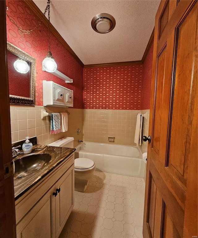 bathroom with a tub to relax in, crown molding, toilet, and a textured ceiling