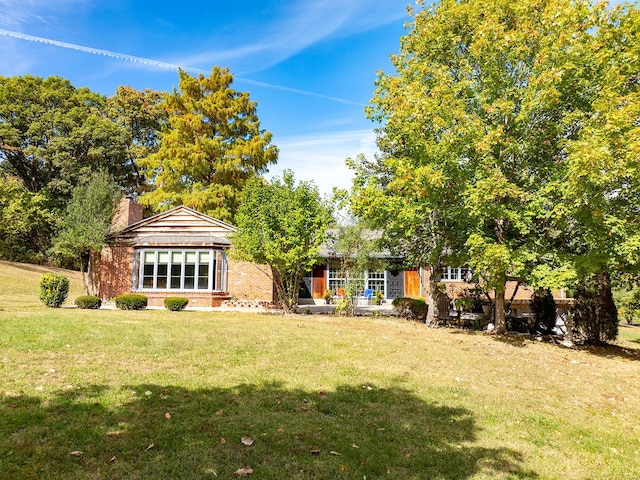 view of front of home with a front yard