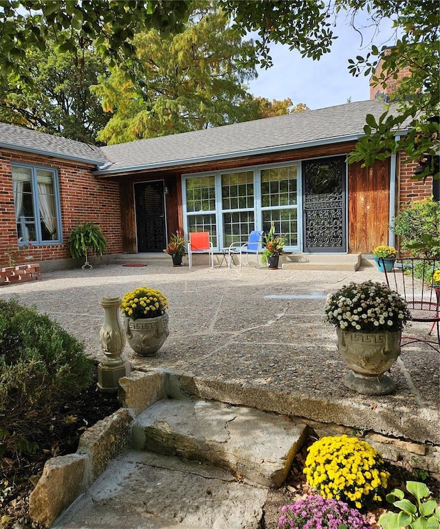 rear view of property featuring a patio