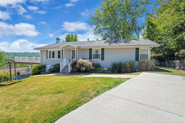 ranch-style home with a front yard