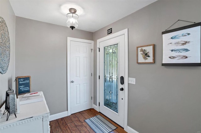 entryway with dark wood-type flooring