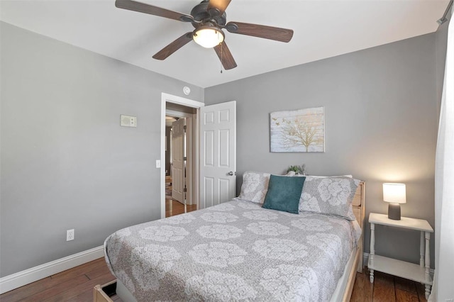 bedroom featuring dark wood-type flooring and ceiling fan