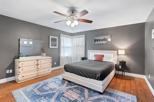 bedroom featuring hardwood / wood-style flooring and ceiling fan