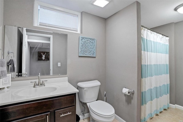 bathroom featuring vanity, curtained shower, toilet, and tile patterned flooring