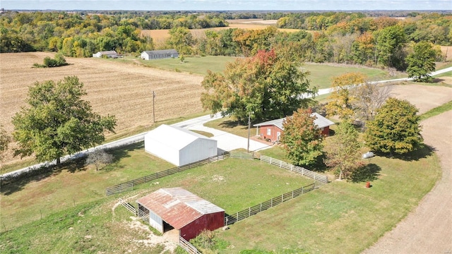 birds eye view of property with a rural view