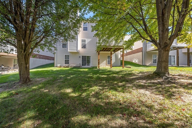 back of house with a yard