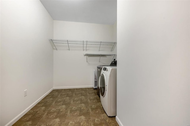 clothes washing area with independent washer and dryer