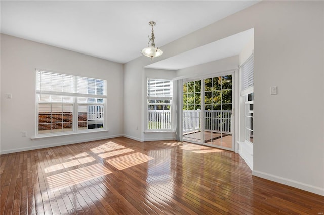 unfurnished room with hardwood / wood-style floors