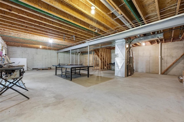 basement featuring heating unit