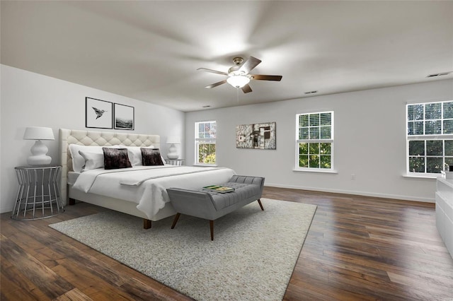 bedroom featuring ceiling fan and dark wood-type flooring