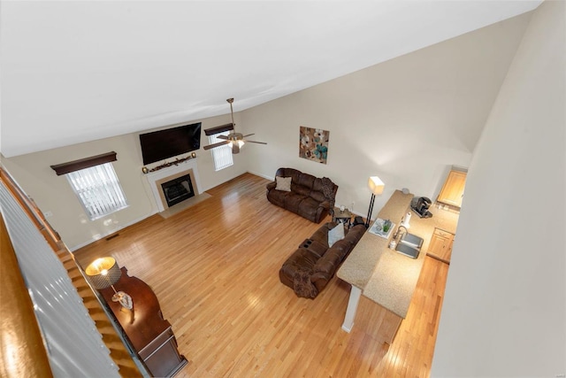 living room with hardwood / wood-style flooring and ceiling fan