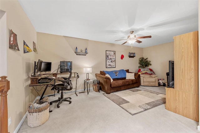 carpeted living room featuring ceiling fan