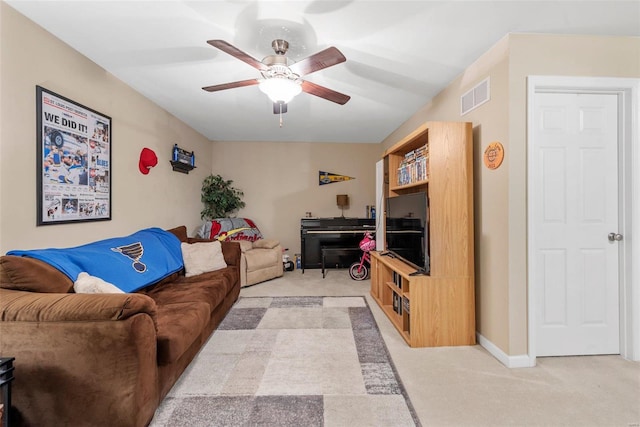 carpeted living room featuring ceiling fan