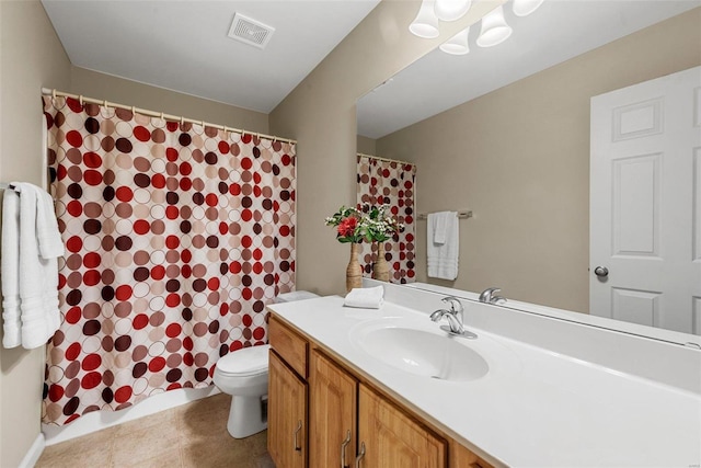 bathroom with a shower with curtain, tile patterned floors, vanity, and toilet