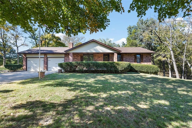 ranch-style home with brick siding, a chimney, an attached garage, a front yard, and driveway