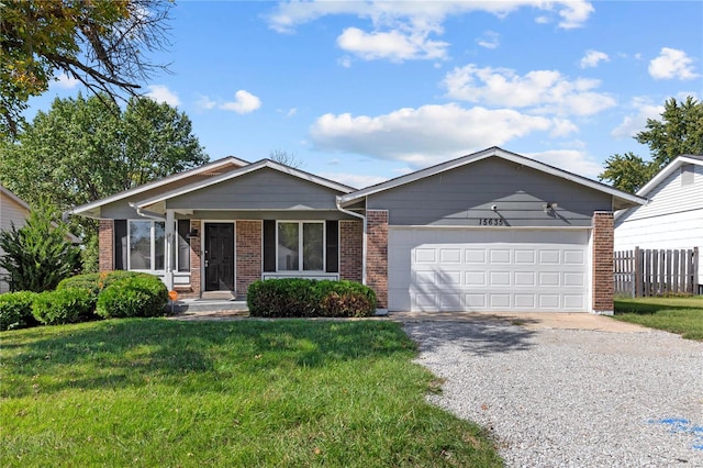 ranch-style home with a front yard and a garage