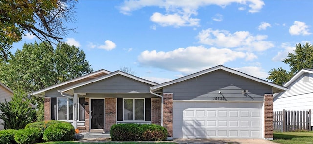 ranch-style home featuring a garage