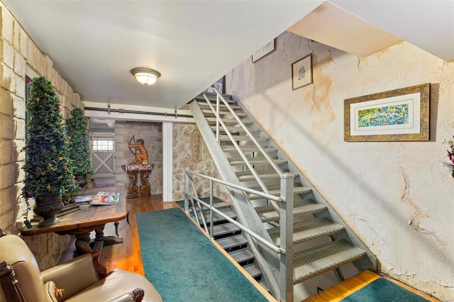 staircase featuring hardwood / wood-style flooring