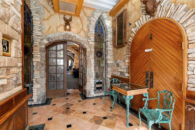 entrance foyer with beam ceiling