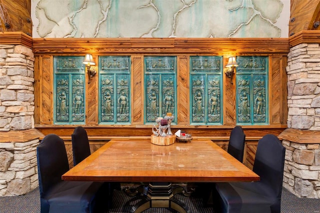 dining area featuring decorative columns