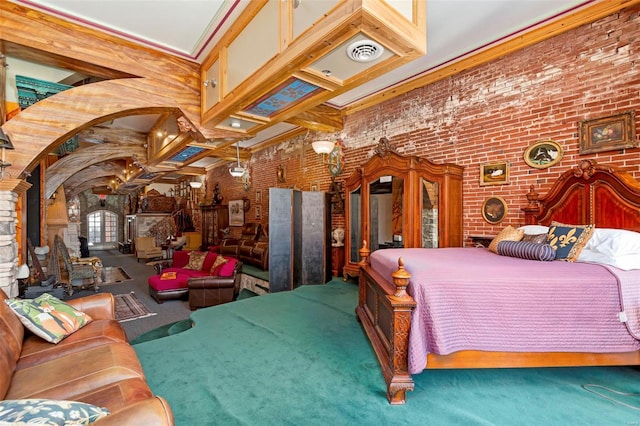 bedroom featuring a high ceiling, beam ceiling, brick wall, crown molding, and carpet floors