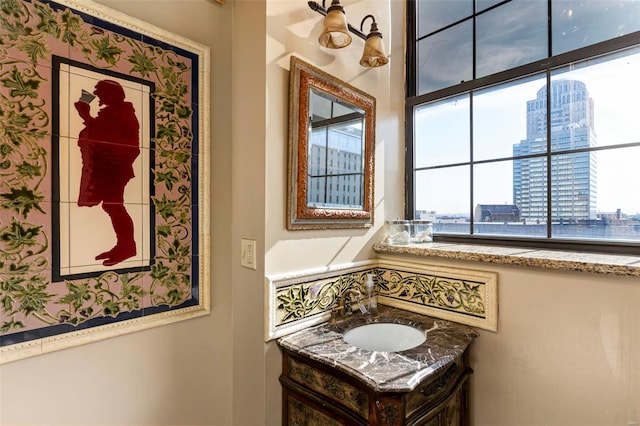 bathroom with vanity and a water view