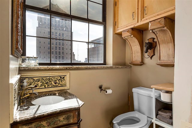 bathroom with vanity and toilet