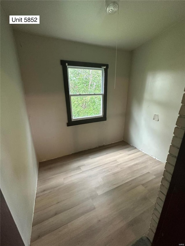 unfurnished room with light hardwood / wood-style floors