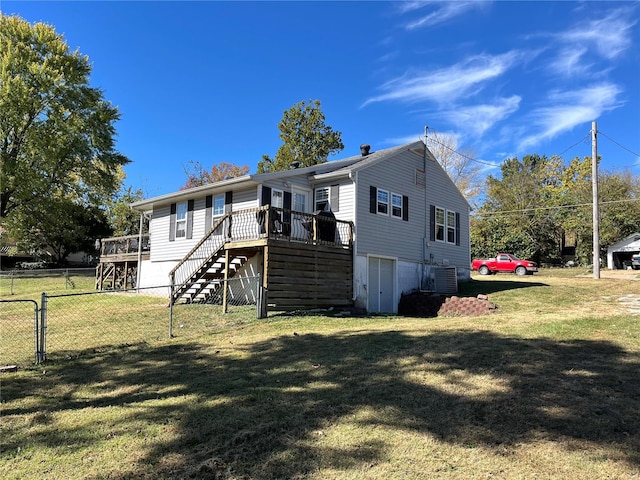 view of front of property featuring a wooden deck, a front lawn, and central air condition unit