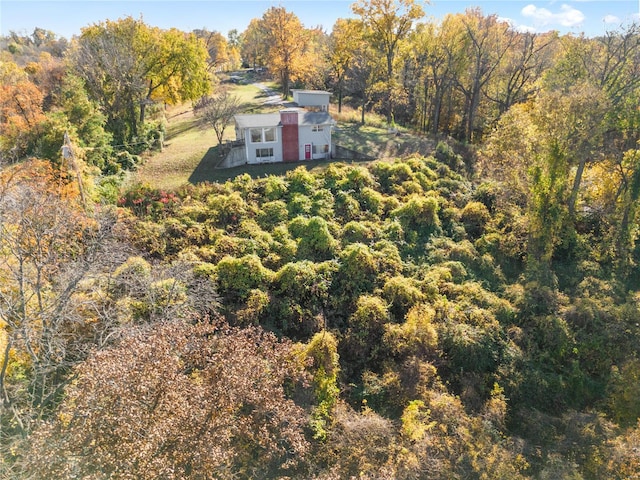 birds eye view of property with a forest view