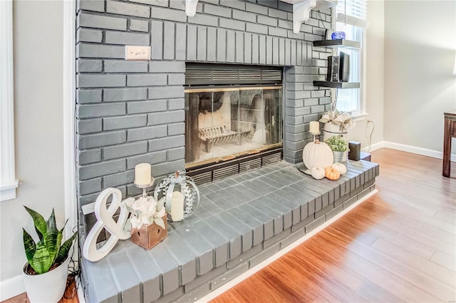 room details featuring hardwood / wood-style flooring and a fireplace