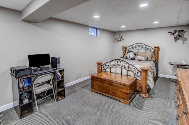 bedroom featuring a paneled ceiling and carpet floors