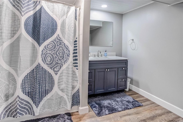 bathroom with vanity, a shower with shower curtain, and hardwood / wood-style flooring